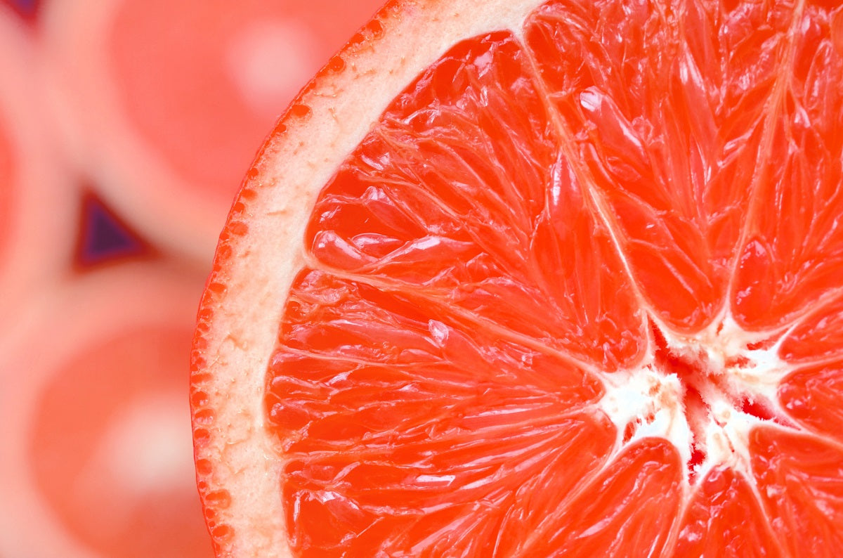 A close-up of a Texas red grapefruit half