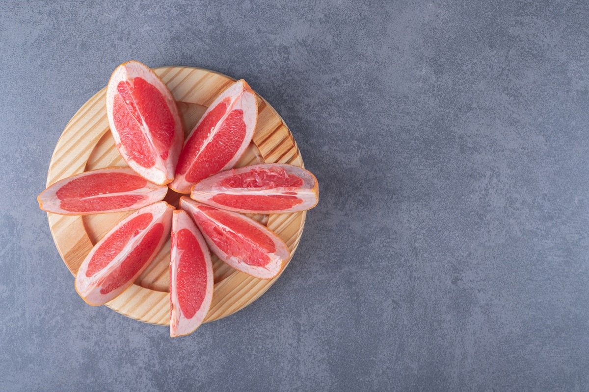Grapefruit slices on a wooden tray
